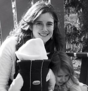 Jessie as a new parent to her second baby (in a well-loved Baby Bjorn)