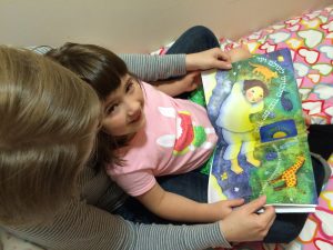 Reading "The Bedtime Sh'ma" to Laurel at bedtime. 