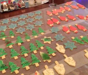 Santas-trees-dreidels-and-stars cookies, iced and ready to eat