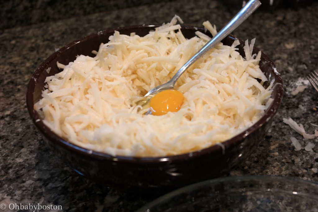 egg yolk in middle of shredded kugel